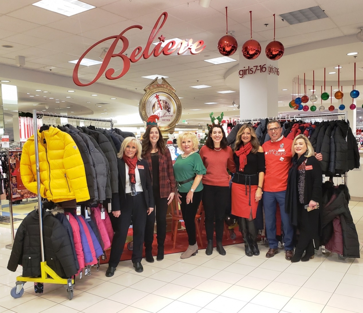 United Way of Greater Plymouth County and Macy’s Kingston Collection Staff  stand with 95 Coats for Low Income Children in Greater Plymouth County